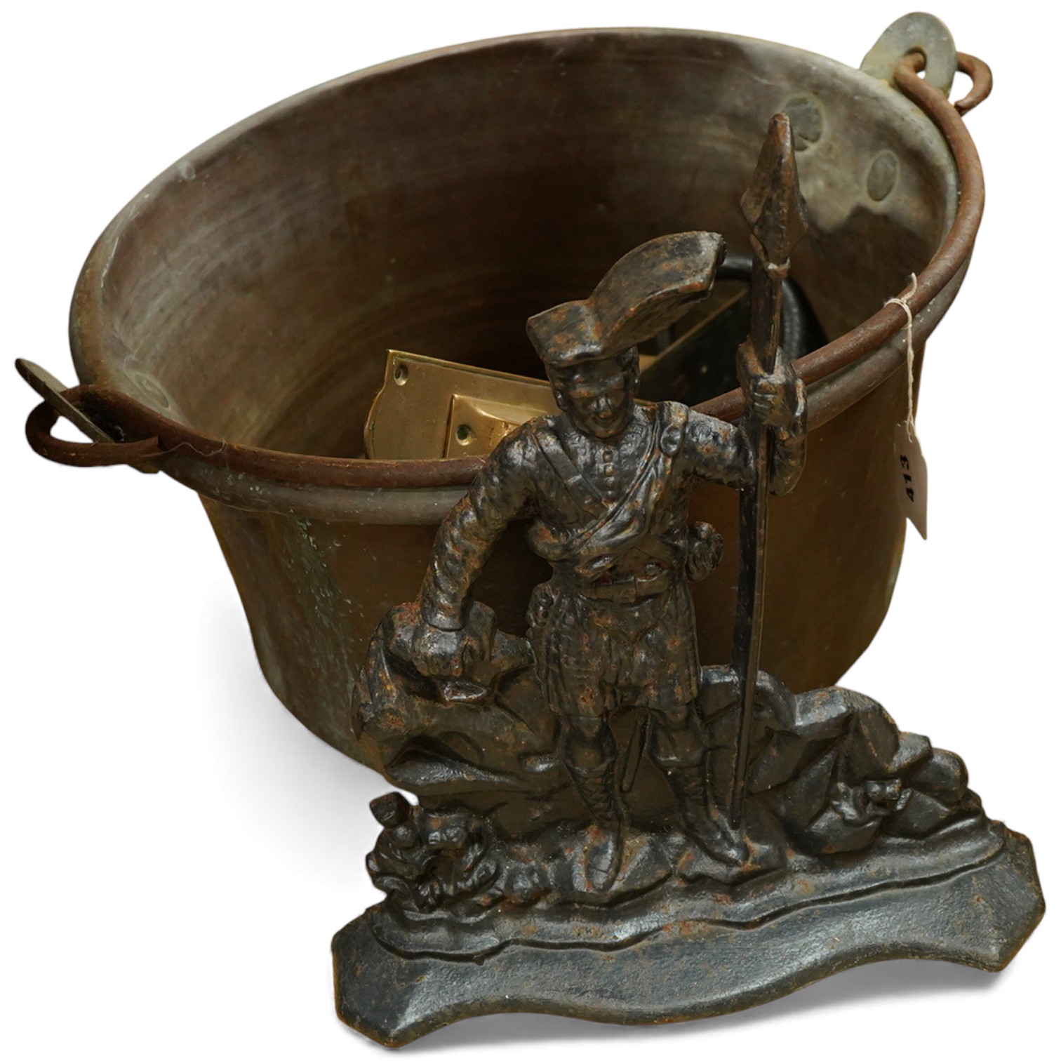 A collection of metalware to include a Victorian copper pan, a figural cast iron doorstop- 39cm high, brass door handles etc